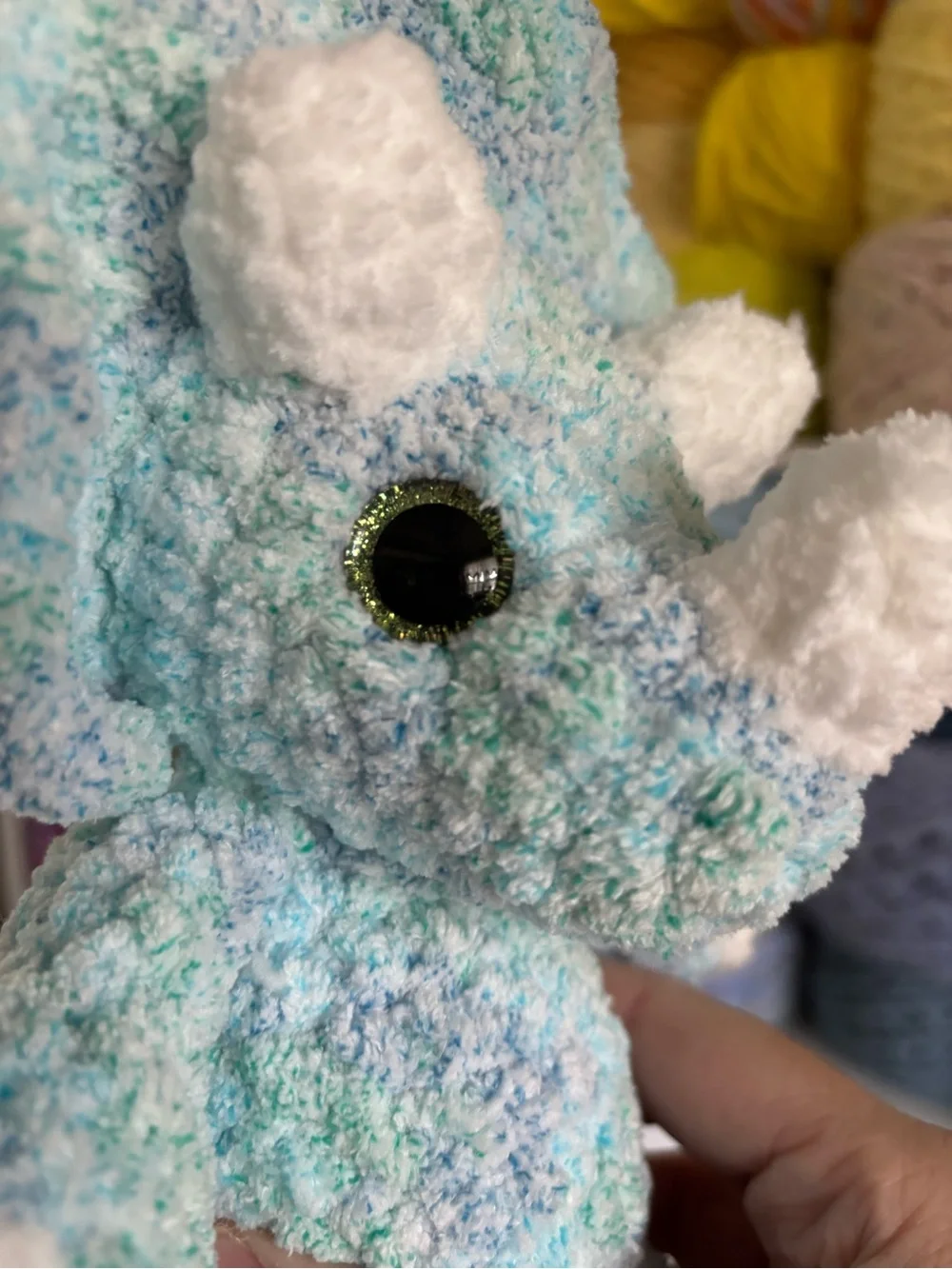 Crochet baby Triceratops plush.